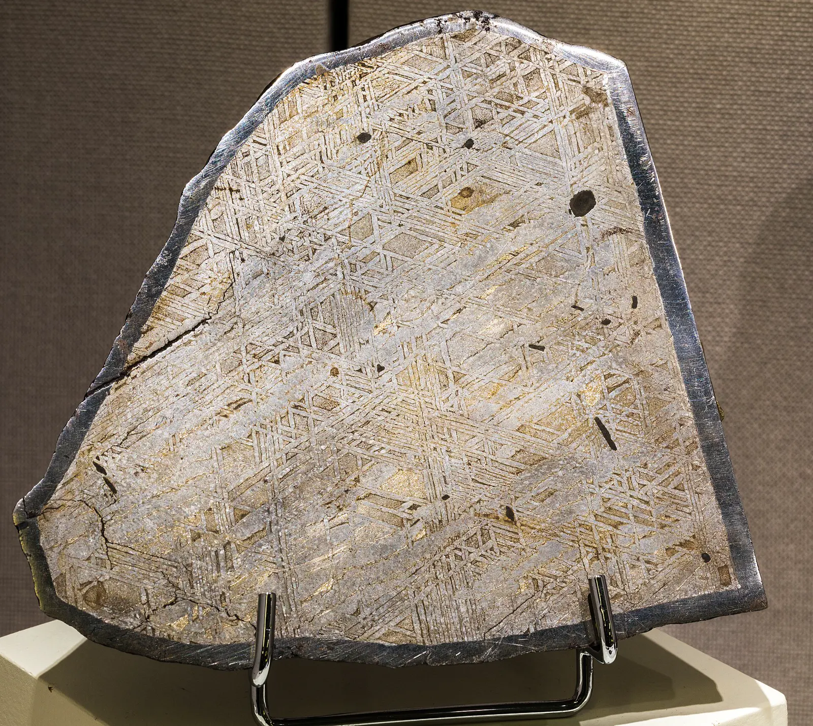An iron meteorite found on Earth, shown because Psyche is thought to be metal-rich. Not a photo of Psyche.