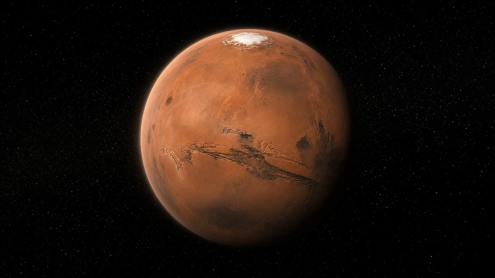 Mars from space: iron rust, polar ice and a thin dusty limb.