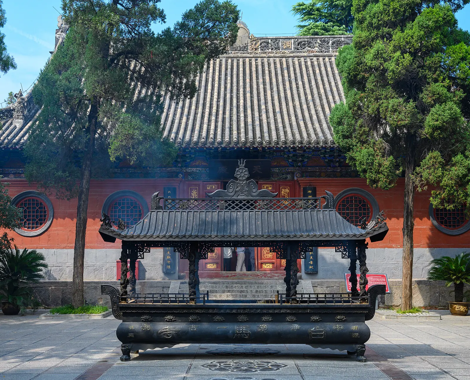 The White Horse Temple in Luoyang, red halls and a blue sky. Tradition links this temple to the first Buddhist texts in China.