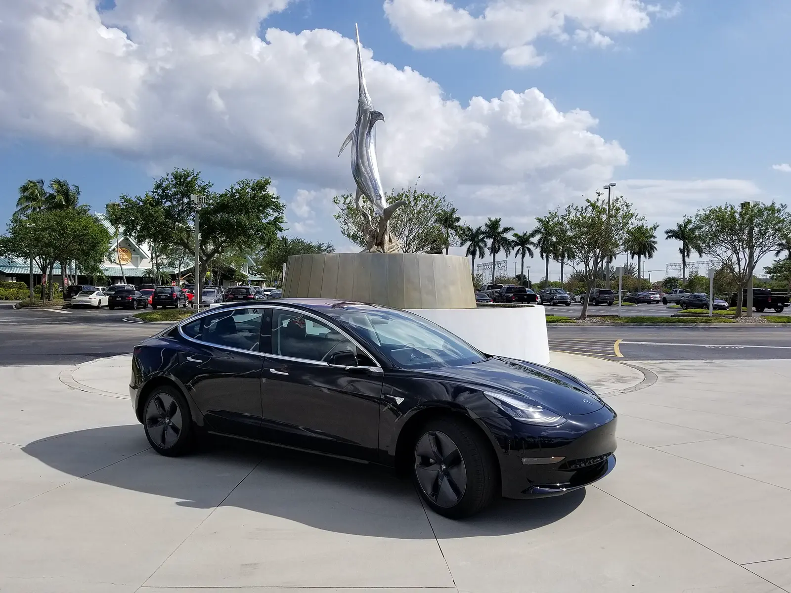 A Tesla car in daylight.