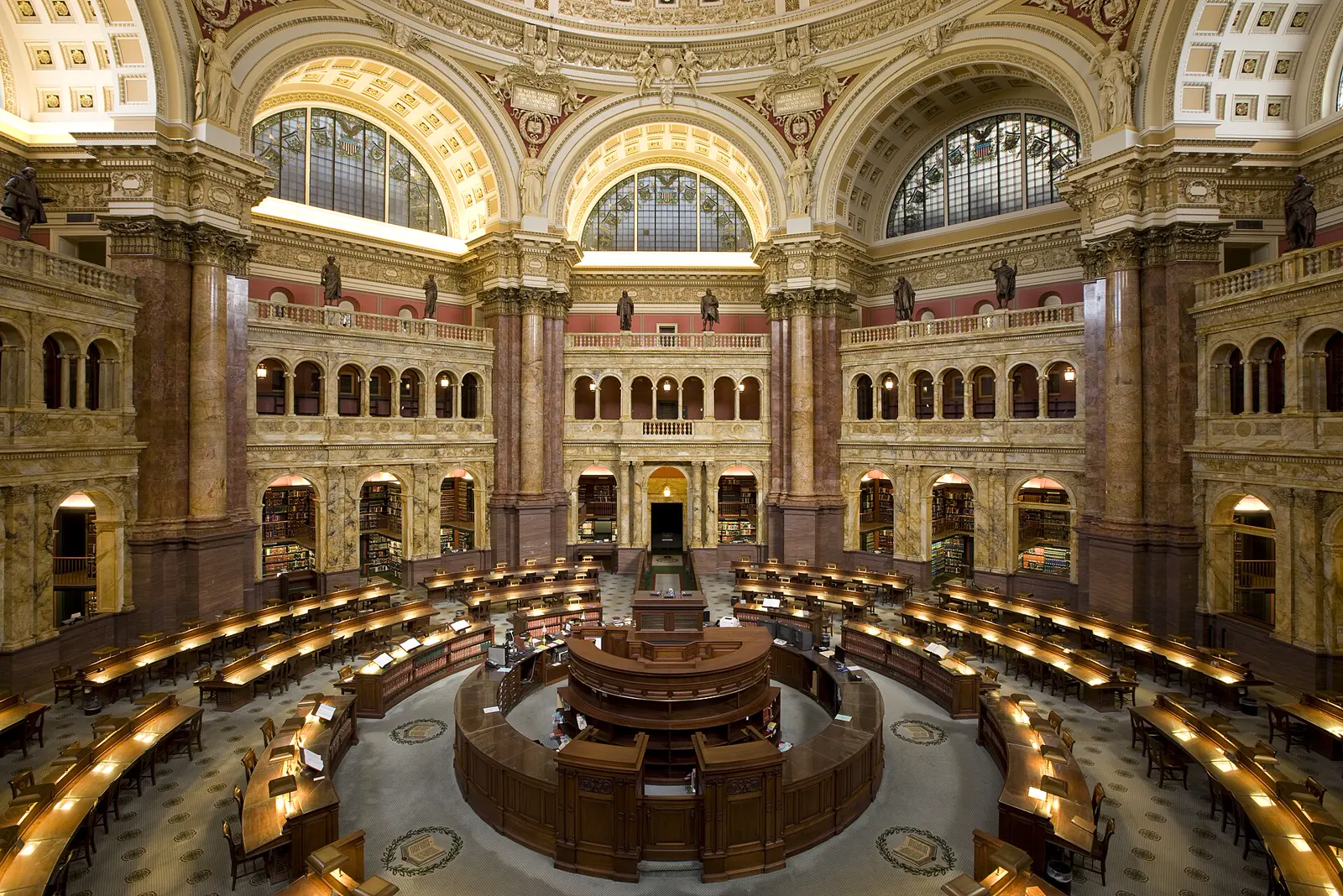 The Main Reading Room of the Library of Congress, lamps in a ring under the dome.